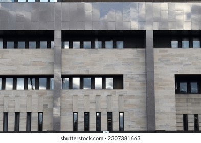 Facade of Modern Office Building with Stone and Metal Cladding 