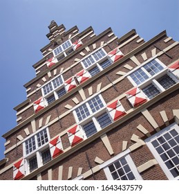 Facade of a monumental house with stepped gable in Leiden, Netherlands