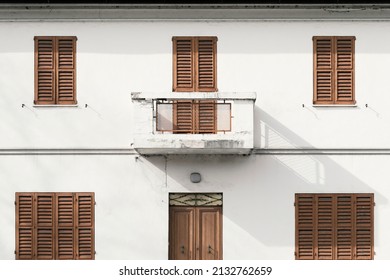 Facade Old Abandoned House With Blinds Closed, Outdoors