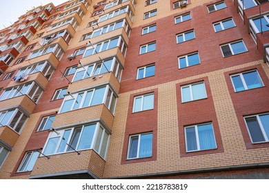 Facade Of An Old Apartment Building With Balconies At Day Time. City Scene, Background Image.