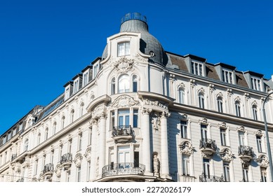 Facade of an old classic building with statues in Innere Stadt, Vienna, Austria