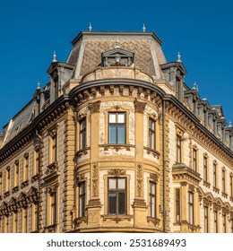 Facade of an old corner building with peeling plaster in Pеcs, Hungary. - Powered by Shutterstock