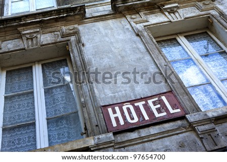 dilapidated building with lettering