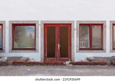 Facade Of A Old House In Germany. Abandoned Hotel In Bavaria. Built In The 70th Industrial Architecture. Simple Construction Building Built In The Seventies. Copy Space For Text