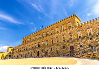 Facade of Palazzo Pitti palace with Gallery of Modern Art large building on Piazza dei Pitti square in historical centre of Florence city, blue sky white clouds, Tuscany, Italy