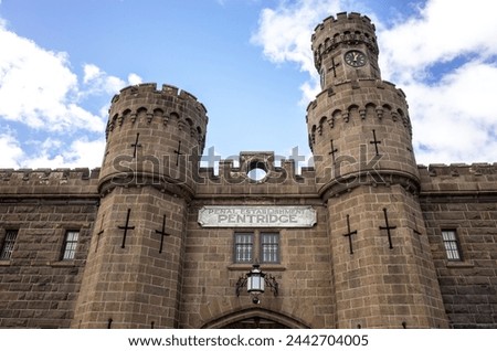 Facade of Pentridge Prison, with iconic bluestone towers and Gothic-inspired heritage architecture, the building is a local landmark of Australia's historical penal system. Coburg Melbourne  Australia