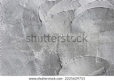 Facade plaster background. Gray plaster stripes pattern. Tile adhesive texture. Home renovation texture. White lines backdrop. Stucco wall background.