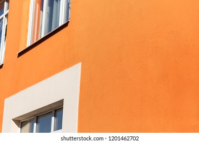 Facade plaster background. Single-ply monolithic plaster decorative background. Single layer scraped cement plaster wallpaper. Exterior building structure backdrop.