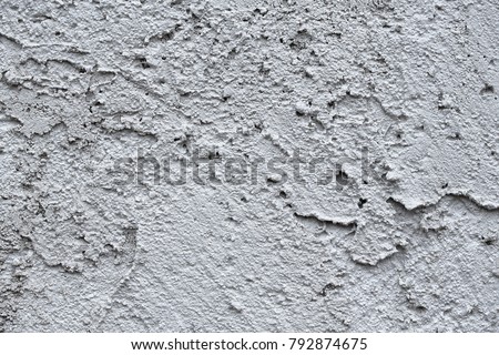 Facade plaster background. Single-ply monolithic plaster decorative background. Single layer scraped cement plaster wallpaper. Exterior building structure backdrop. Silica  sand Cement Wall Plaster. 