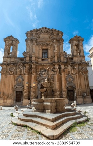 Facade of the Purgatory Church or Chiesa Del Purgatorio and the fountain in the old town of Marsala, Sicily, Italy,