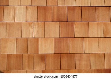 Facade with rectangular wooden shingles at a house in the Alps, switzerland, europe