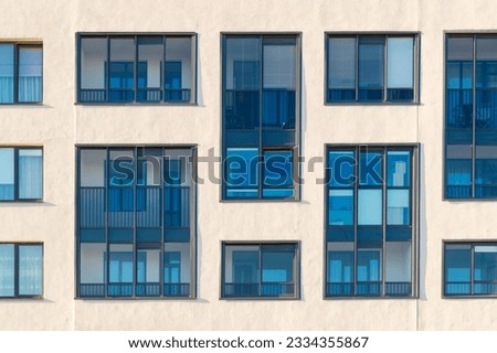 Facade of a residential apartment building. Pattern with windows