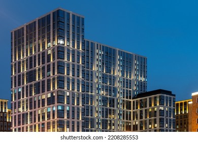 The facade of a residential building in the evening with street lighting . Modern architecture . Night City.  - Shutterstock ID 2208285553
