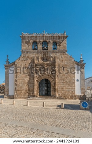 Facade of the sixteenth century Gothic Manueline church with a three bells belfry, in the town of Vila Nova de Foz Coa, Portugal