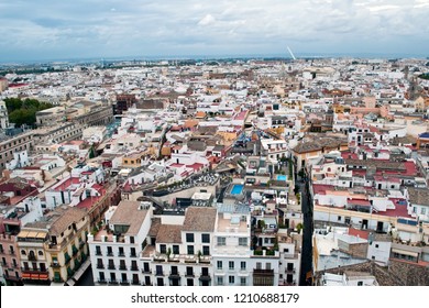 Facades of old houses in various colors lying about the other aldo in the Spanish city of Seville  - Shutterstock ID 1210688179