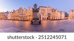 Facades of old multi-colored houses on the Town Hall Square in Poznan at dawn