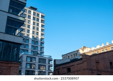 The facades of two old brick historic buildings: a factory building and a residential building, apartments building - Powered by Shutterstock