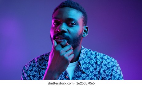 Face African American Stylish Man Happy Look At Camera Thinking Posing On The Blue And Violet Neon Light Background Attractive Beard Black Blue Boy Bright Cheerful Portrait Close Up Slow Motion