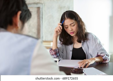 Face Of Asian Younger Woman Seriously Thinking In Family Problem