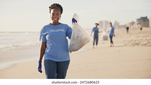 Face, beach or happy black woman with plastic bag for earth day, sustainability or ocean cleaning project. Recycle, sustainability and portrait of volunteer at sea for NGO, accountability or charity - Powered by Shutterstock