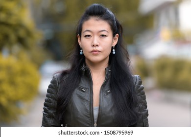 Face Of Beautiful Asian Rebellious Woman Outdoors