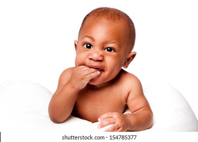 Face Of Beautiful Cute Teething Baby Biting Fingers With Funny Expression, On White.