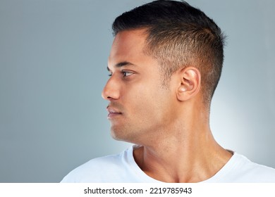 Face, Beauty And Masculine With A Man Model Profile In Studio On A Gray Background For Skincare Or Wellness. Luxury, Health And Cosmetics With A Handsome Young Male Posing To Promote Health Skin