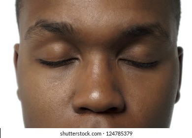 A face of the black American man with close eyes