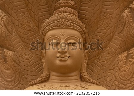 The face of the Buddha image has beautiful art patterns.
