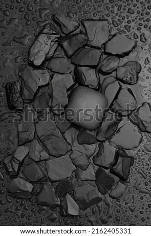 Face care concept, carbon soap scrub, healthy and beauty stilllife photo on black rocks 