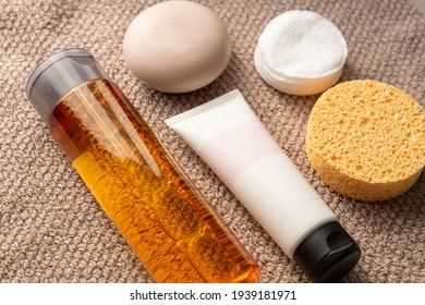 Face Care Concept. Cream, Soap Bar, Sponge, Cotton Pads And Losion On A Towel.