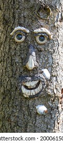 Face carved into an old tree trunk