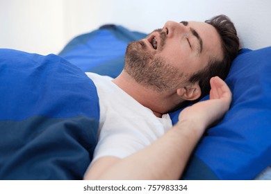 Face Close Up Of Snoring Man Because Of Hypopnea Disorder