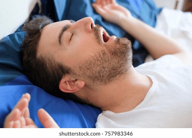 Face Close Up Of Snoring Man Because Of Hypopnea Disorder