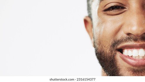 Face, closeup and man in studio for skincare, happy and laughing against white background. Zoom, smile and portrait of Indian male model excited for wellness, beauty and cosmetic care while isolated - Shutterstock ID 2316154377
