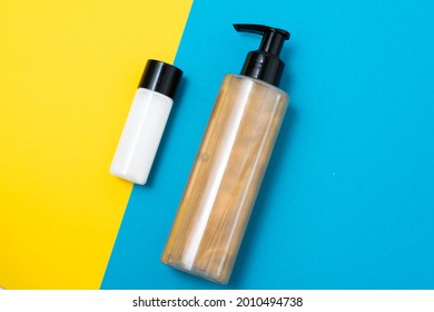 Face Cream And Bronzer Cream With Sparkles On Blue And Yellow Background