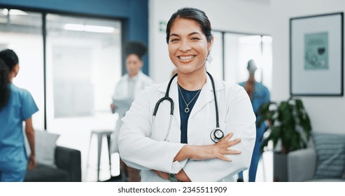 Face, doctor and arms crossed in busy hospital for about us, medical life insurance or wellness support. Smile, happy and healthcare woman in portrait, confidence trust or clinic medicine leadership - Powered by Shutterstock