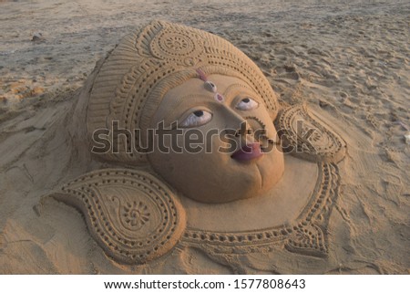 Face of Durga Idol made by a sand artist at the sea beach of Puri, Odisha