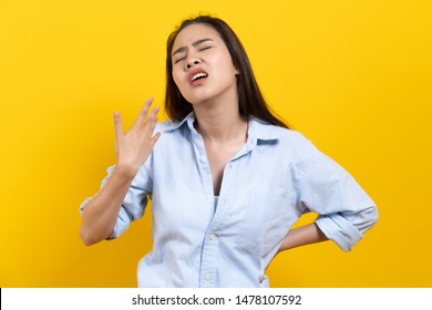 Face Expression Of Human. Asian Beautiful Female Expression Feeling Hot Weather In The Summer Day In Studio Shoot Yellow Background.