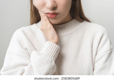 Face expression suffering from sensitive teeth and cold, asian young woman, girl feeling hurt, pain touching cheek, mouth with hand. Toothache molar tooth, dental problem isolated on white background.