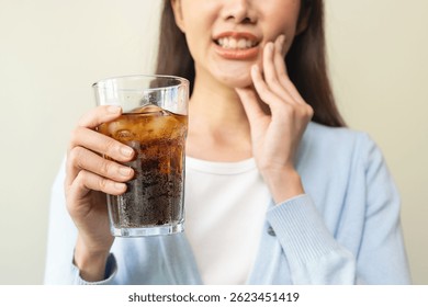Face expression suffering from sensitive teeth, Asian young woman touching cheek