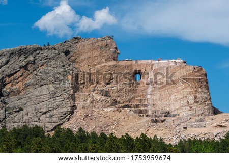 The face of the famous Native American Chief Crazy Horse begins to emerge from an ongoing construction project at a stone mountain in South Dakota.