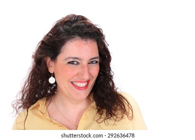 Face Forward Headshot Of A Happy Smiling Spanish Woman With Dark Hair Brown Eyes Wearing A Yellow Blouse