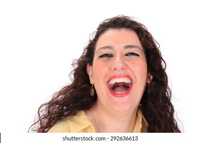 Face Forward Headshot Of A Laughing Spanish Woman With Dark Hair Brown Eyes Wearing A Yellow Blouse