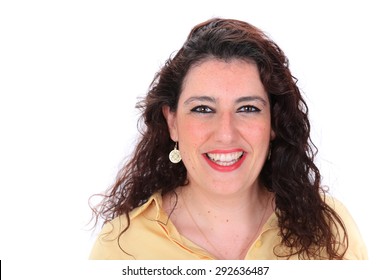 Face Forward Headshot Of A Spanish Woman With Dark Curly Hair Brown Eyes Wearing A Yellow Blouse