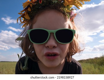 Face Girl 5 Years Old In Black Sunglasses Against The Sky,summer Time Concept.