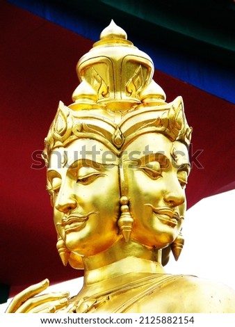 The face of the golden statue of Brahma