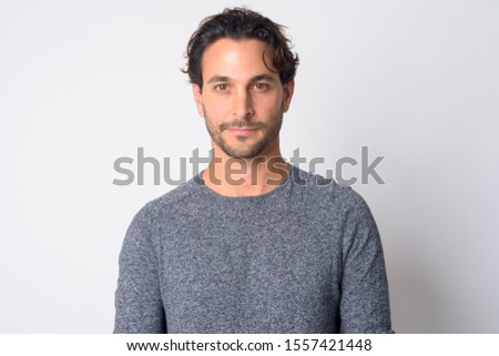 Face of handsome Hispanic man looking at camera