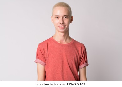 Face of happy young handsome androgynous man smiling - Powered by Shutterstock