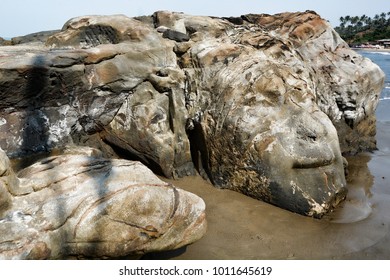 The Face Of The Hindu God Shiva Carved In Natural Stone At The Anjuna Beach In North Goa.India